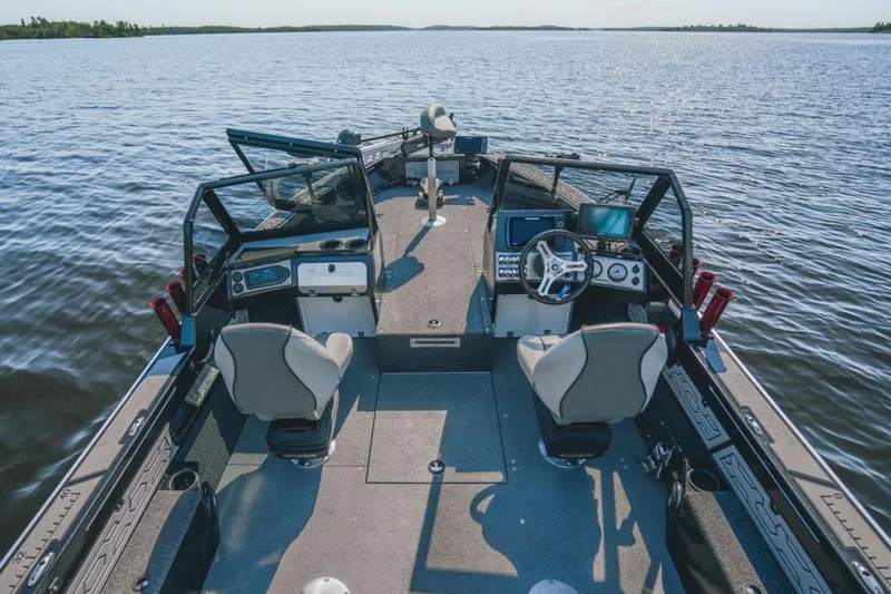 Slide: The Image of 2026 KingFisher 1925 Arrow Sport boat interior on a serene lake. - 7