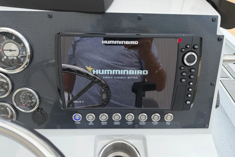 Slide: The Image of 2022 Xpress H20B Bay boat dashboard with Humminbird Helix 9 fishfinder display. - 12
