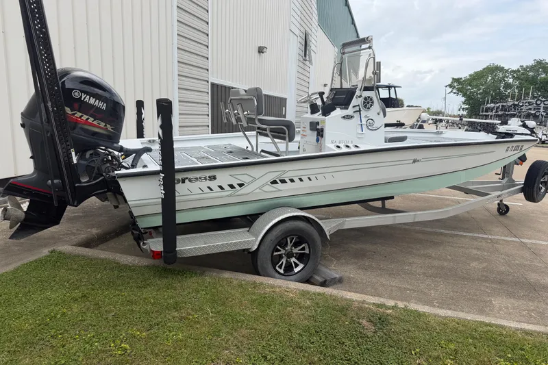 Slide: The Image of 2022 Xpress H20B Bay boat on trailer with Yamaha outboard motor. - 3
