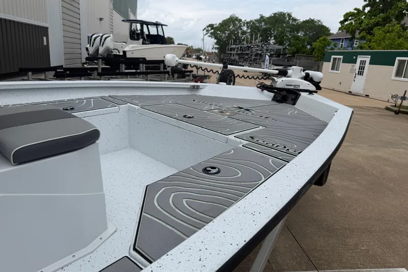 Slide: The Image of 2022 Xpress H20B Bay boat with sleek deck design and modern seating. - 6