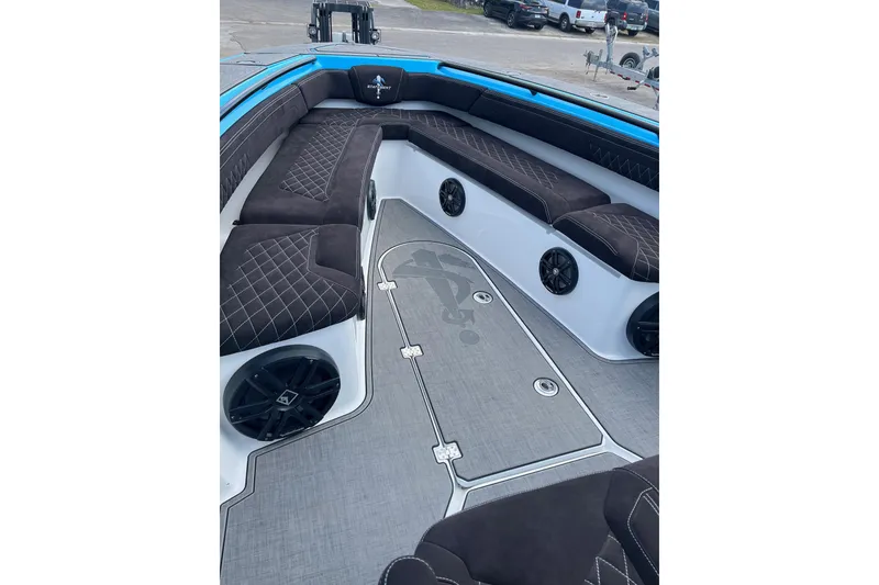 Slide: The Image of Blue 2025 Statement 350 Open boat docked with triple outboard engines. - 2