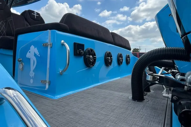 Slide: The Image of Interior of 2025 Statement 350 Open boat with cushioned seating and speakers. - 8