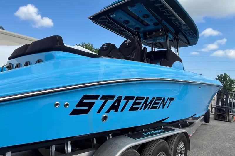Slide: The Image of Blue 2025 Statement 350 Open boat interior with luxury seating and sleek design. - 9