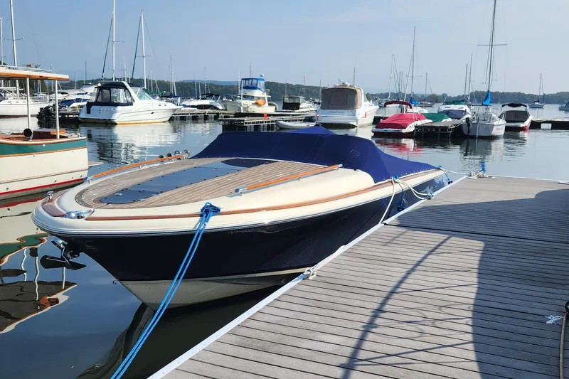 Slide: The Image of 2014 Chris Craft Corsair 34 docked at a marina with other boats. - 4
