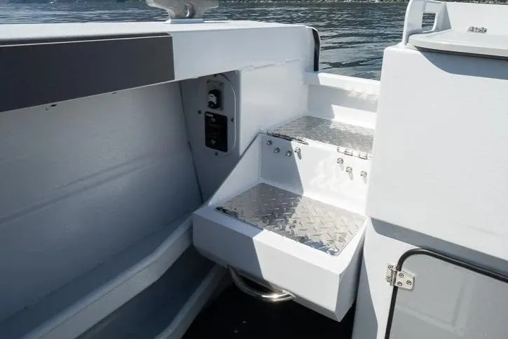 Slide: The Image of Interior view of 2026 KingFisher 2325 Coastal Express boat with metal steps. - 12