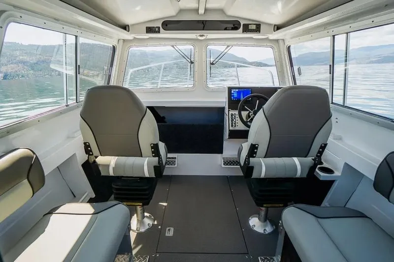 Slide: The Image of Interior of 2026 KingFisher 2325 Coastal Express boat with modern seating and controls. - 4