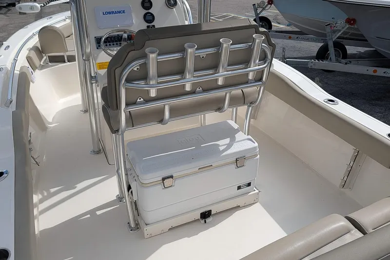 Slide: The Image of 2021 Key West 219 FS boat interior with cooler and rod holders. - 13