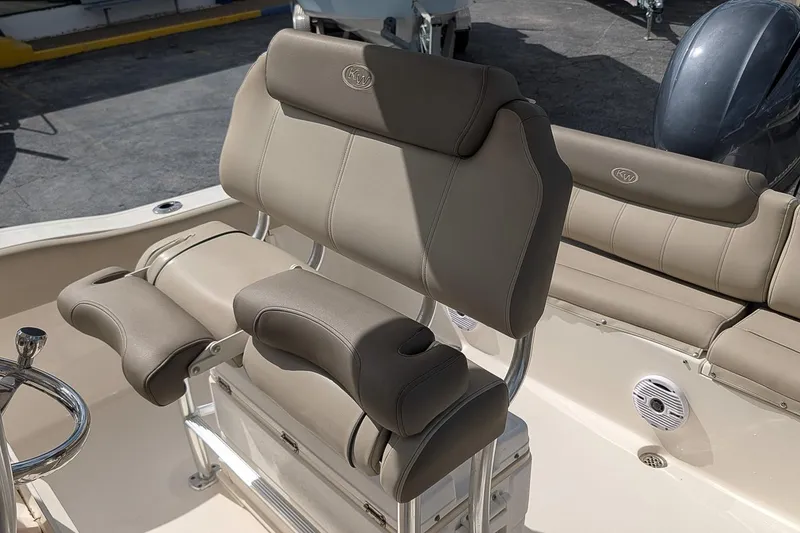 Slide: The Image of 2021 Key West 219 FS boat seating with beige upholstery and stainless steel frame. - 14