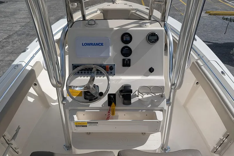 Slide: The Image of 2021 Key West 219 FS boat console with steering wheel and Lowrance electronics. - 15
