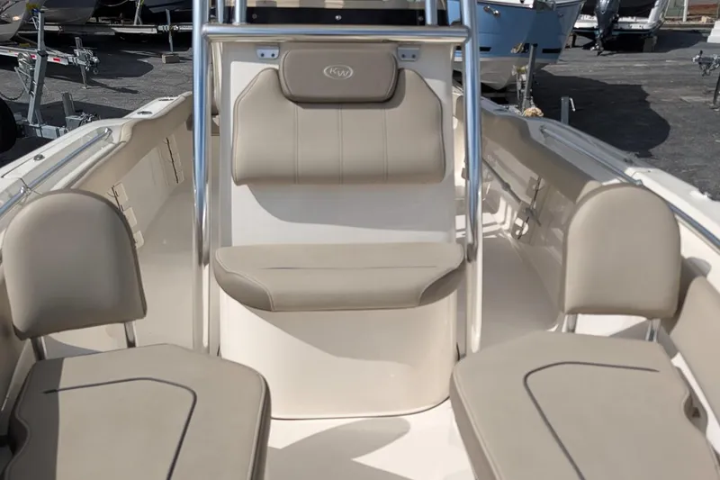 Slide: The Image of 2021 Key West 219 FS boat interior with beige seating and console. - 18