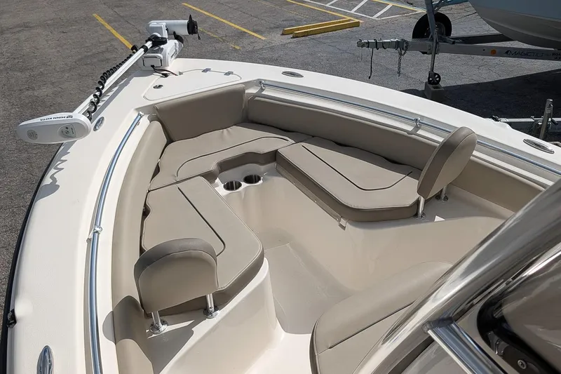 Slide: The Image of 2021 Key West 219 FS boat interior with cushioned seating and cup holders. - 19