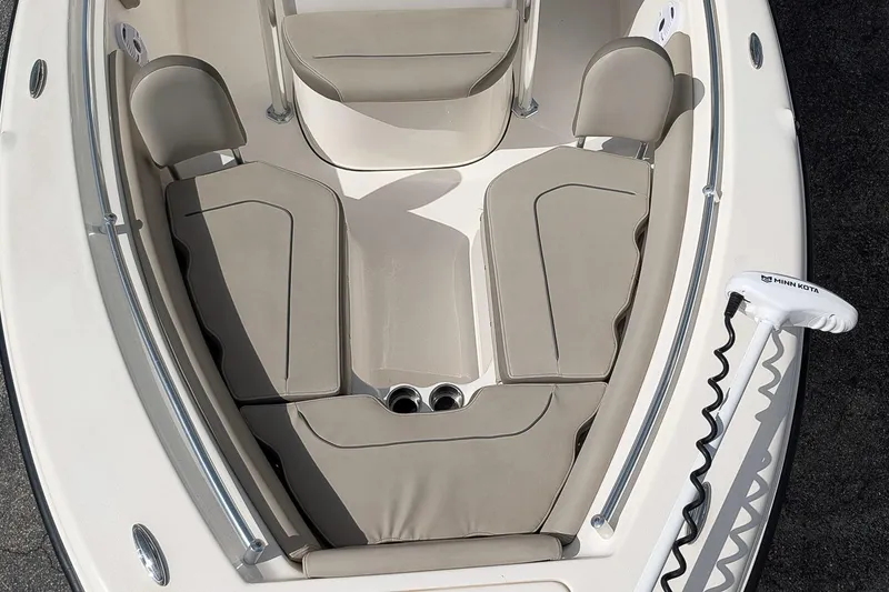 Slide: The Image of 2021 Key West 219 FS boat interior with cushioned seating and Minn Kota trolling motor. - 20