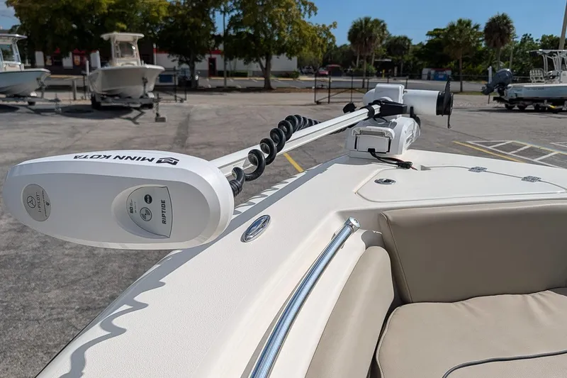 Slide: The Image of 2021 Key West 219 FS boat with Minn Kota trolling motor in a parking lot. - 21