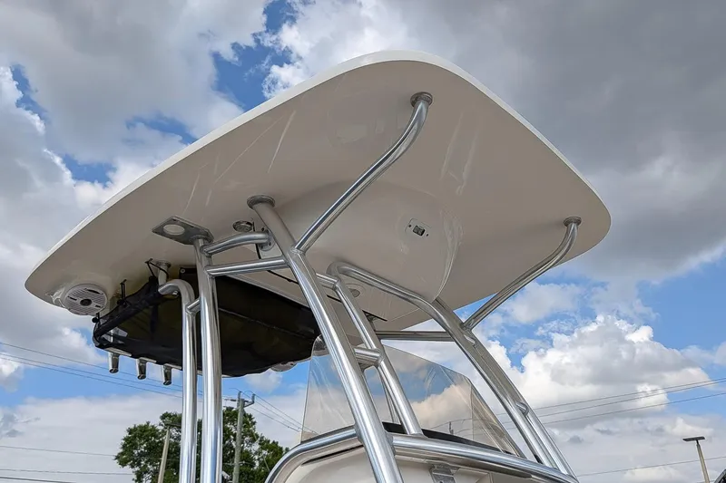 Slide: The Image of 2021 Key West 219 FS boat's T-top against a cloudy sky backdrop. - 22
