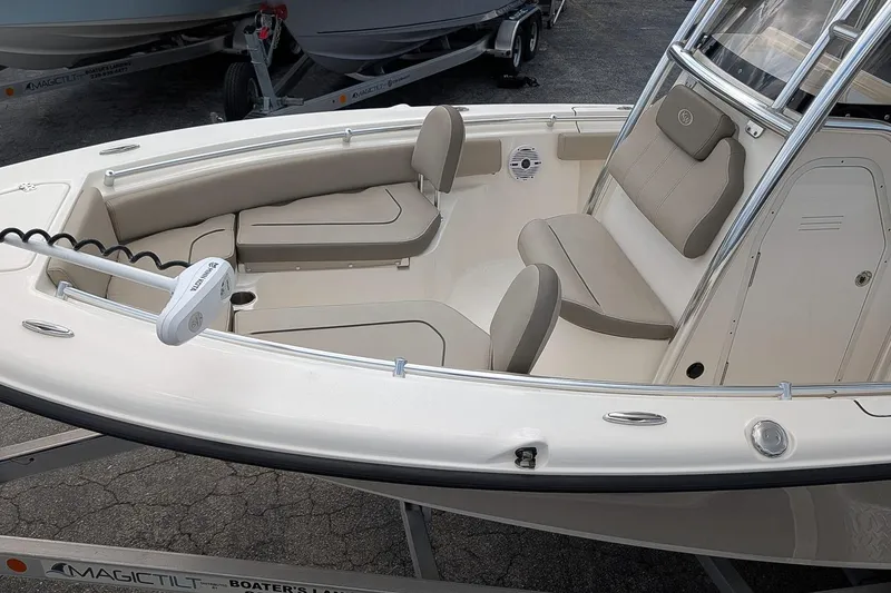 Slide: The Image of 2021 Key West 219 FS boat interior with cushioned seating and modern design. - 8