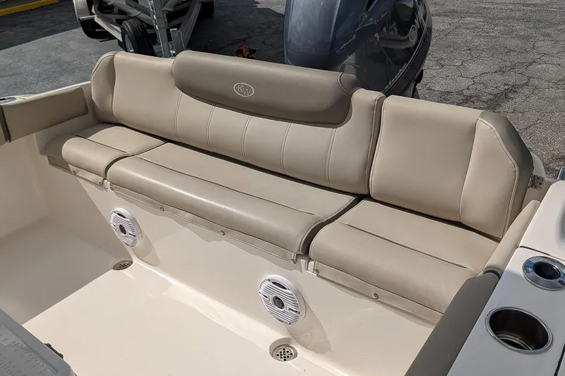 Slide: The Image of 2021 Key West 219 FS boat seating with beige upholstery and built-in speakers. - 9