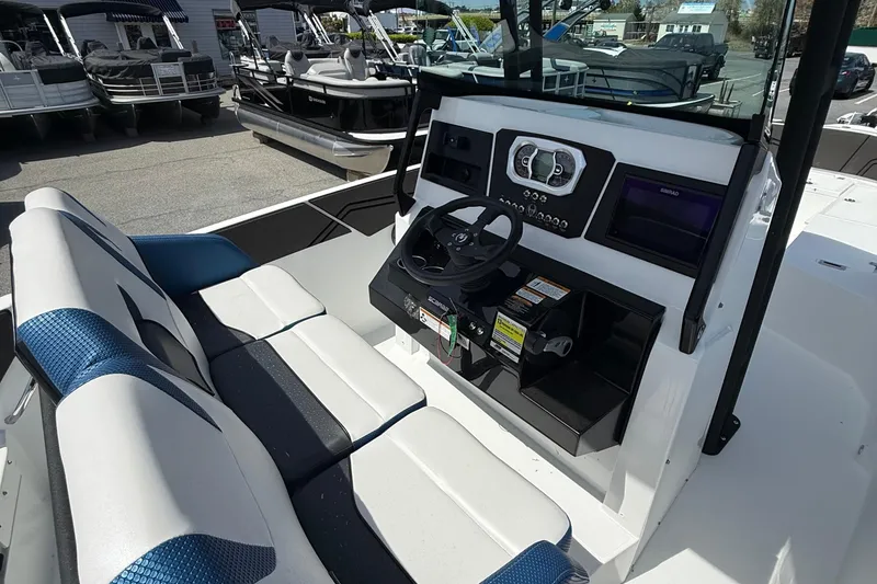 Slide: The Image of 2021 Scarab 255 Open ID boat interior with steering console and seating. - 11