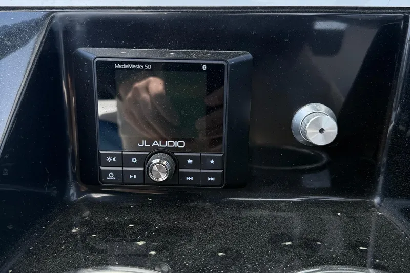 Slide: The Image of JL Audio MediaMaster 50 control panel on 2021 Scarab 255 Open ID boat. - 13