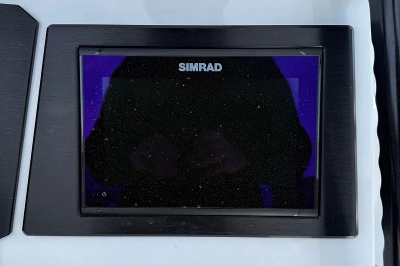 Slide: The Image of Simrad display on 2021 Scarab 255 Open ID boat dashboard. - 15