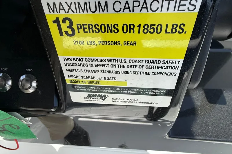 Slide: The Image of 2021 Scarab 255 Open ID boat capacity label, 13 persons or 1850 lbs, safety compliance. - 20