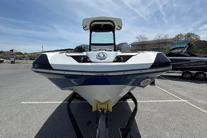 Slide: The Image of 2021 Scarab 255 Open ID boat on trailer in parking lot, front view. - 3