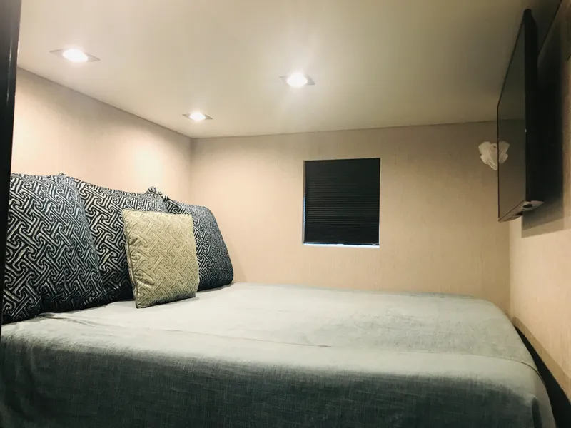 Slide: The Image of Cozy bedroom interior in 2018 Adonia Adonis Trip 3 RV with modern lighting. - 10