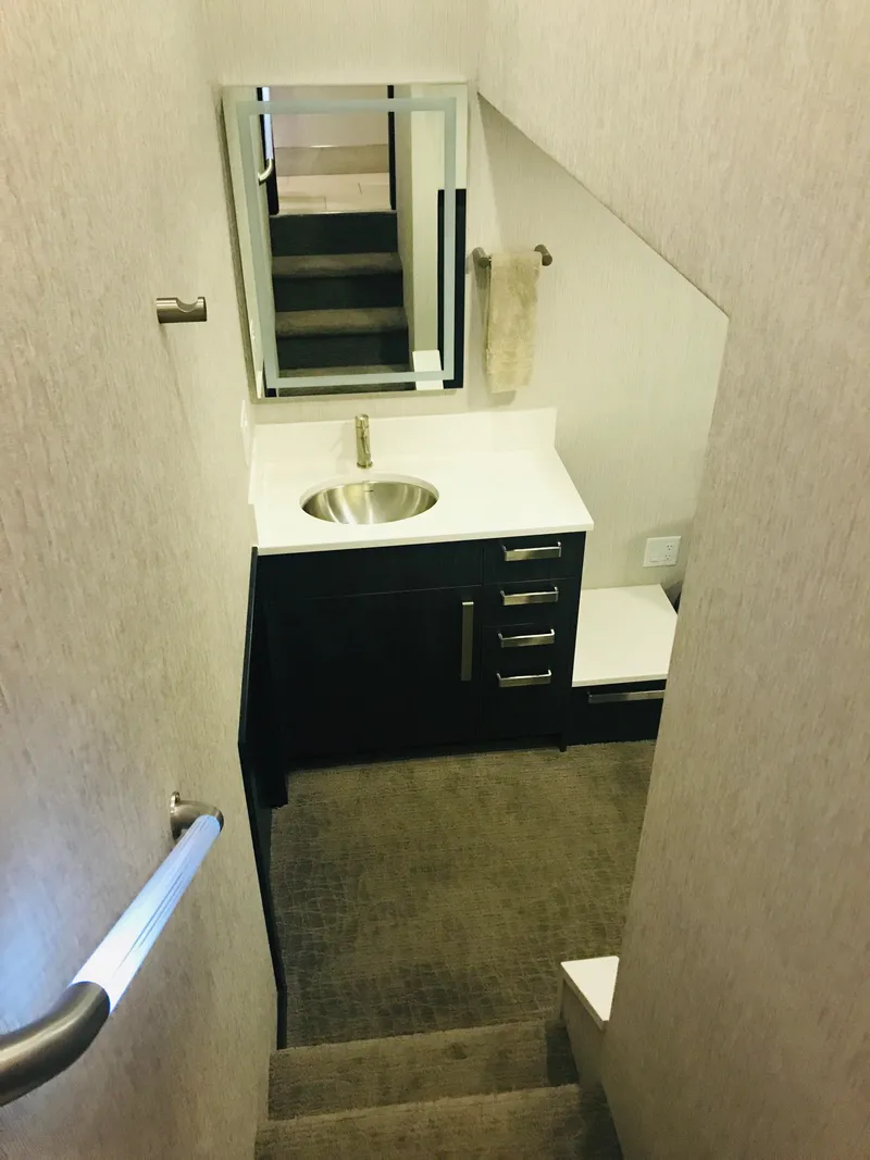 Slide: The Image of Compact bathroom in 2018 Adonia Adonis Trip 3 RV with modern sink and mirror. - 16