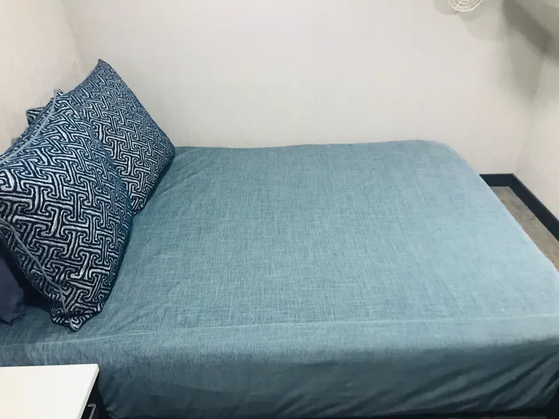 Slide: The Image of Compact bedroom with blue bedding and patterned pillows, Adonia Adonis Trip 3, 2018. - 17