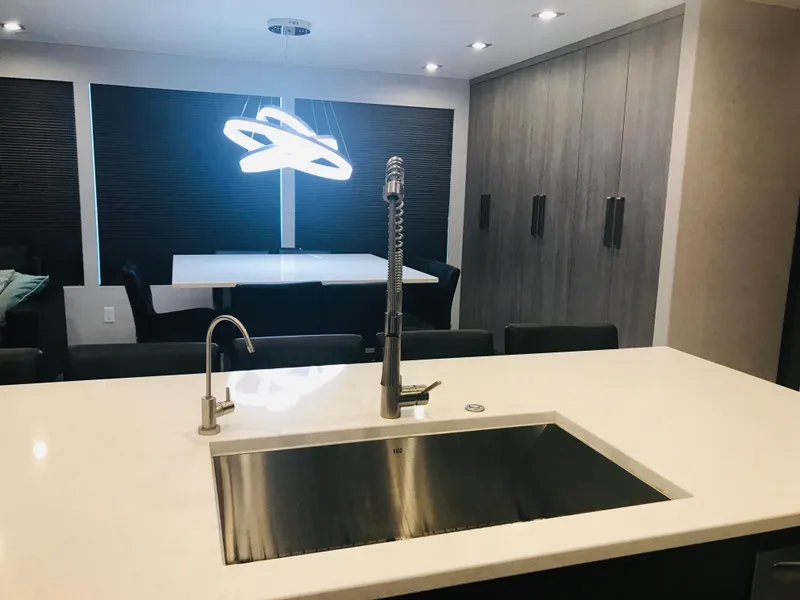 Slide: The Image of Modern kitchen with sleek sink, contemporary lighting, and minimalist design in Adonia Adonis Trip 3, 2018. - 23