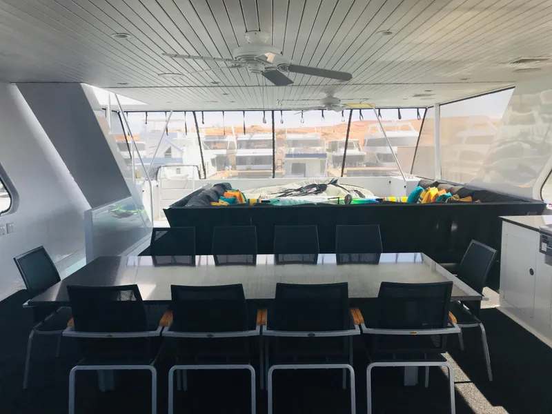 Slide: The Image of Luxurious interior of 2018 Adonia Adonis Trip 3 yacht with dining area and large windows. - 29