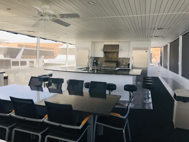 Slide: The Image of Spacious interior of 2018 Adonia Adonis Trip 3 houseboat with modern kitchen and dining area. - 32