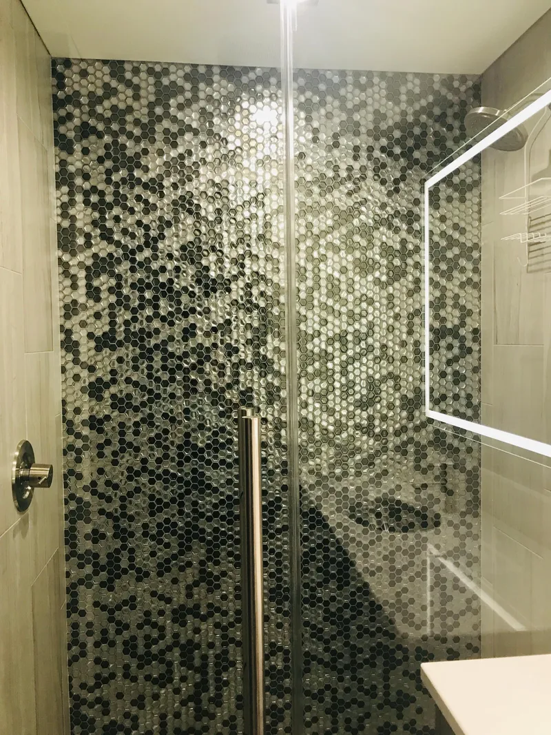 Slide: The Image of Modern shower with hexagonal mosaic tiles and glass door, Adonia Adonis Trip 3, 2018 model. - 4