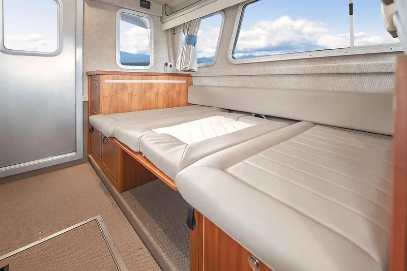 Slide: The Image of Interior of 2026 KingFisher 3225 GFX Offshore boat with comfortable seating and windows. - 10