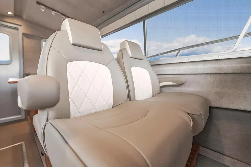 Slide: The Image of Luxurious interior seating of 2026 KingFisher 3225 GFX Offshore boat with elegant design. - 11