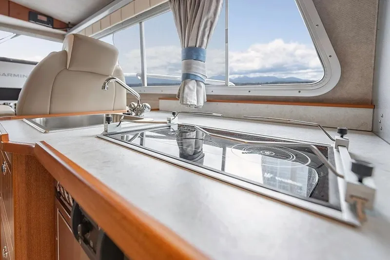 Slide: The Image of Interior of 2026 KingFisher 3225 GFX Offshore boat with modern kitchen amenities. - 14