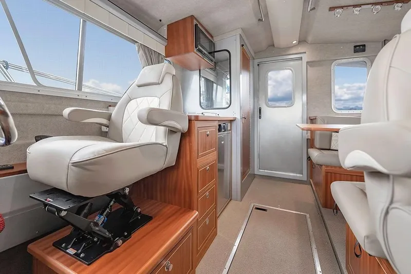 Slide: The Image of Luxurious interior of 2026 KingFisher 3225 GFX Offshore boat with plush seating and modern design. - 16