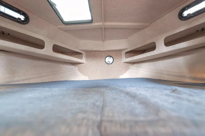 Slide: The Image of Interior cabin of 2026 KingFisher 3225 GFX Offshore boat, featuring spacious sleeping area. - 23