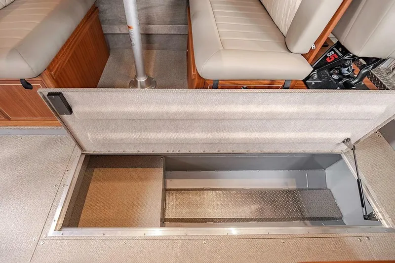 Slide: The Image of 2026 KingFisher 3225 GFX Offshore boat interior with open storage compartment. - 25