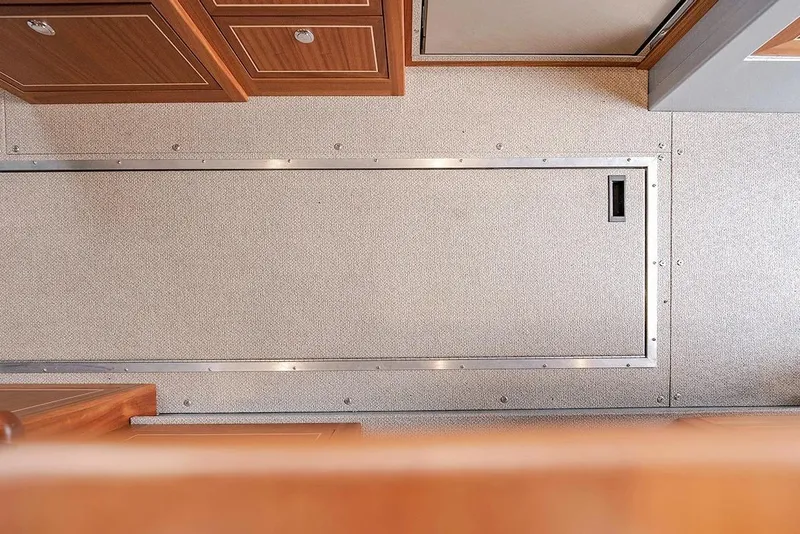 Slide: The Image of Interior view of 2026 KingFisher 3225 GFX Offshore boat, featuring sleek cabinetry and flooring. - 26