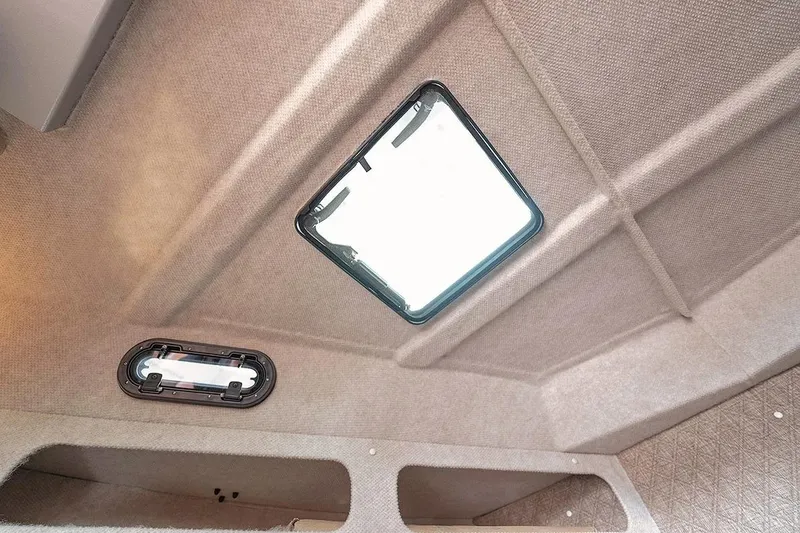 Slide: The Image of Interior ceiling view of 2026 KingFisher 3225 GFX Offshore boat with hatch and light fixture. - 29