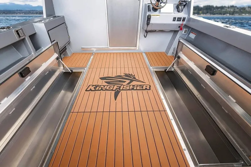Slide: The Image of Interior of 2026 KingFisher 3225 GFX Offshore boat with branded flooring and storage compartments. - 35