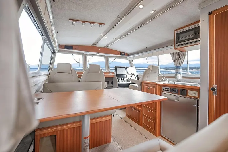 Slide: The Image of Luxurious interior of 2026 KingFisher 3225 GFX Offshore boat with modern amenities and seating. - 7