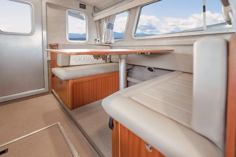 Slide: The Image of Interior of 2026 KingFisher 3225 GFX Offshore boat with seating and table. - 9
