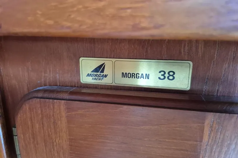 Slide: The Image of Plaque on 1987 Morgan 384 yacht interior, displaying "Morgan 38" branding. - 24