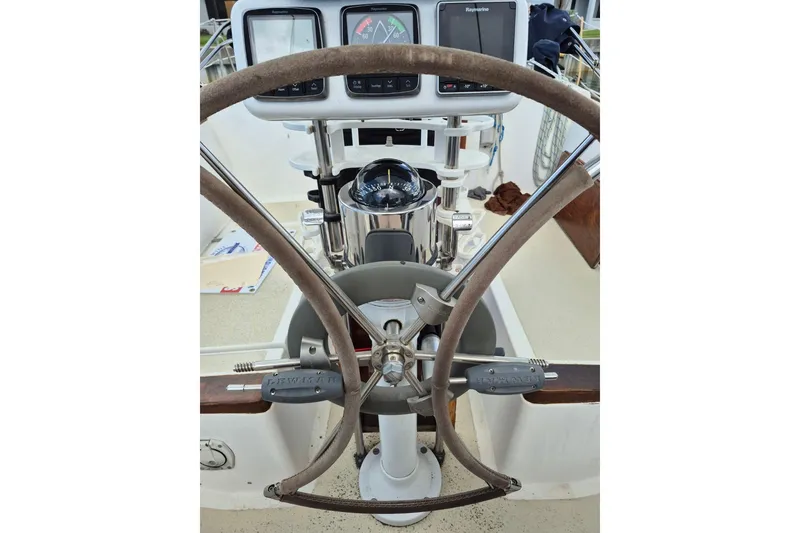 Slide: The Image of Steering wheel and navigation instruments on a 1987 Morgan 384 sailboat. - 25