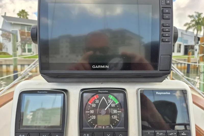 Slide: The Image of Garmin and Raymarine navigation equipment on a 1987 Morgan 384 sailboat. - 27