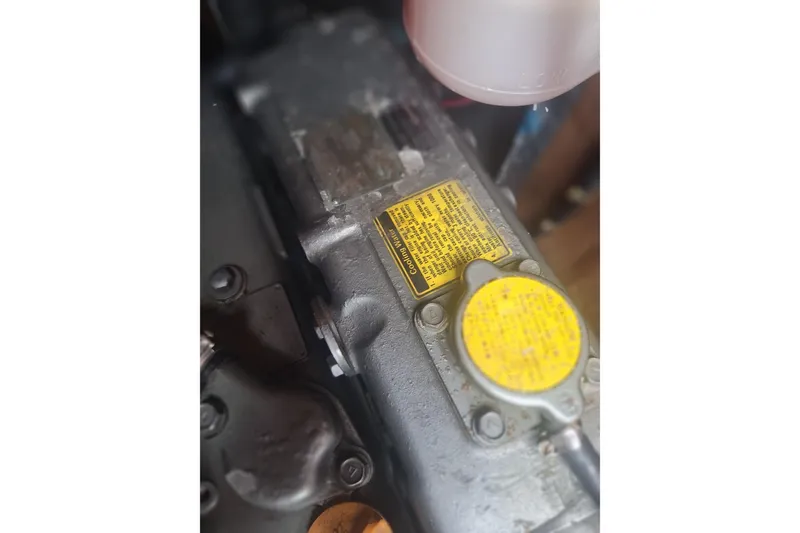 Slide: The Image of Close-up of a 1987 Morgan 384 engine component with yellow labels. - 31