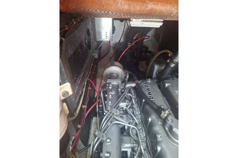Slide: The Image of Engine compartment of a 1987 Morgan 384 sailboat with visible Yanmar engine components. - 33