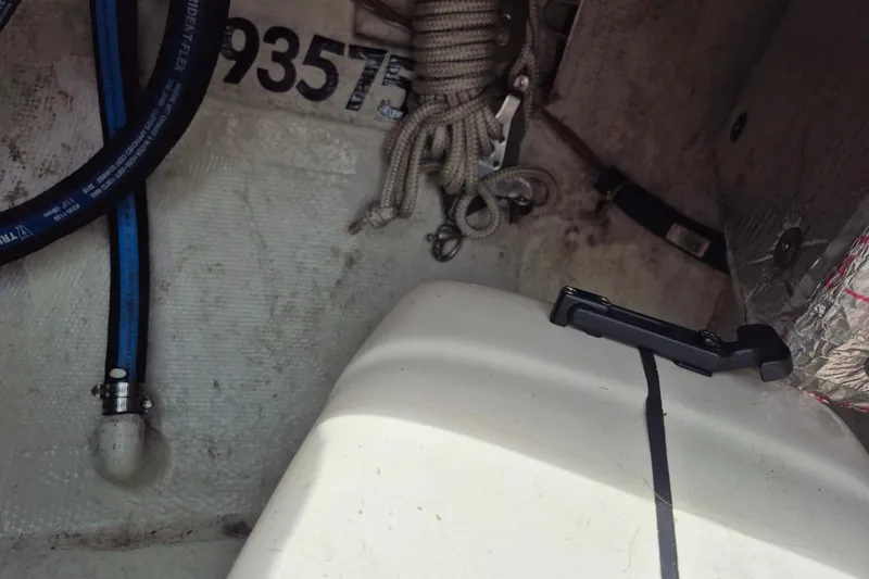 Slide: The Image of Interior view of a 1987 Morgan 384 sailboat, showing ropes and equipment. - 34