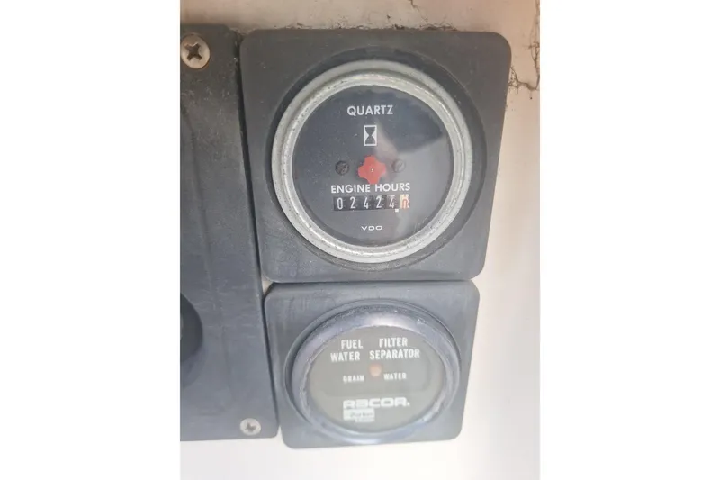 Slide: The Image of Close-up of 1987 Morgan 384 engine hour meter and fuel filter separator. - 42